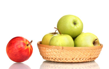 juicy green apples in the basket and red apple isolated on white