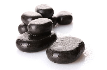 Spa stones with drops isolated on white
