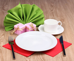 Table setting on wooden background