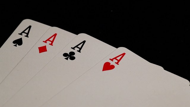 cards : four aces being spread