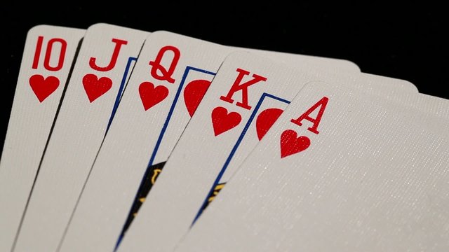 royal flush being spread high contrast  black background