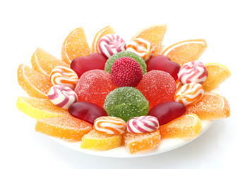 colorful jelly candies on plate isolated on white
