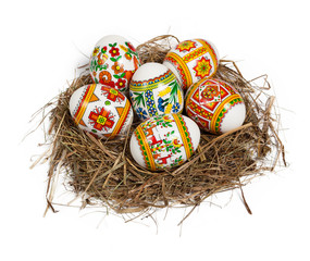 Easter eggs in nest isolated on white