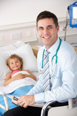 Fototapeta premium Doctor with child patient in UK Accident and Emergency