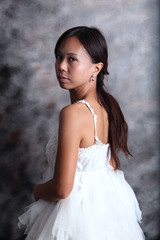 Fototapeta na wymiar women in white dress bride in studio light