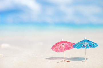 Small umbrellas on tropical beach