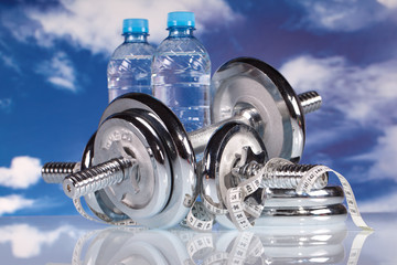 Obraz premium fitness barbell and water