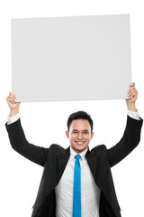 business man holding a blank billboard
