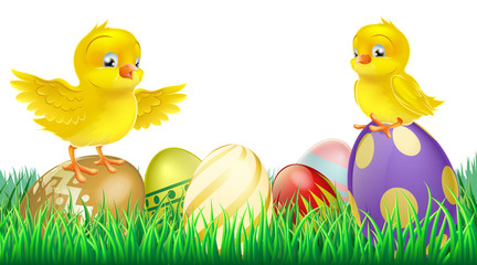 Cute yellow chicks on Easter eggs