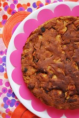 Homemade apple cake on colorful background