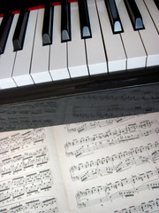 Fototapeta premium Piano keys with notes, musical background.