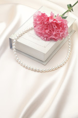 Pearl necklace and Carnation