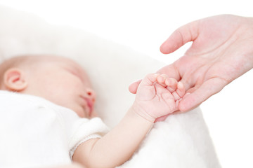 Obraz na płótnie Canvas parent's hand holding baby's hand