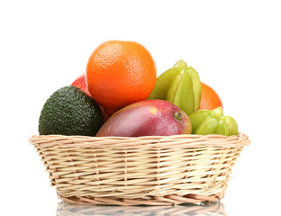 Assortment of exotic fruits in basket isolated on white