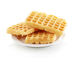 Sweet waffles on plate isolated on white
