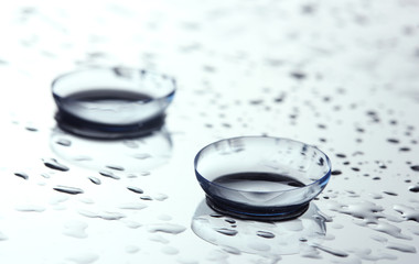 contact lens with drops on white background