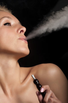 Woman smokes a hookah
