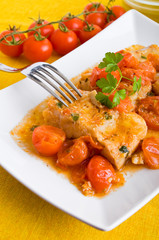 Fish and cherry tomatoes. Pesce con pomodorini.