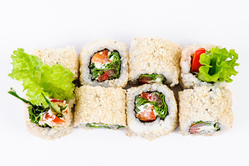 Sushi set with leawes salad and paprika