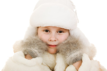 Obraz premium The girl in warm clothes smiling on white background.