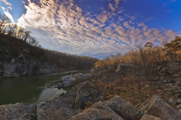 White water river, rocks and sky