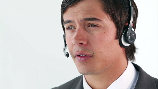 Smiling businessman using a headset