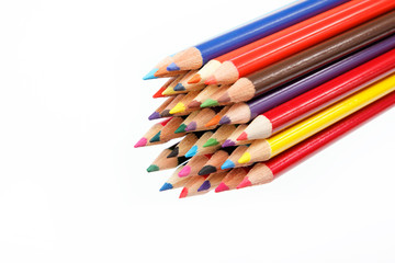 Close up of color pencils with different color over white backgr