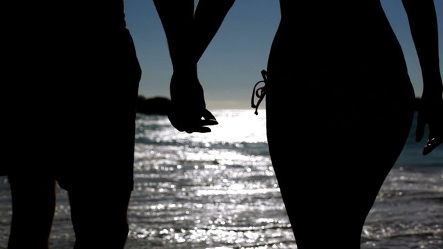 Couple walking under the moonlight