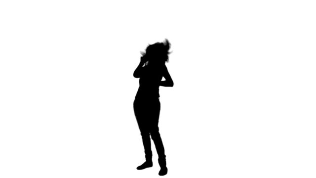 Silhouette of a woman talking on the telephone