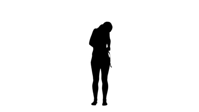 Silhouette woman holding a measuring tape