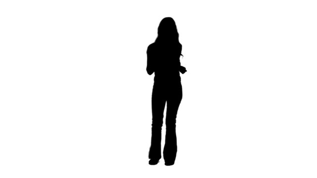 Silhouette woman is casually dancing alone