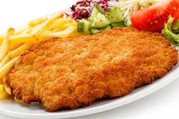 Pork chop, French fries and vegetables