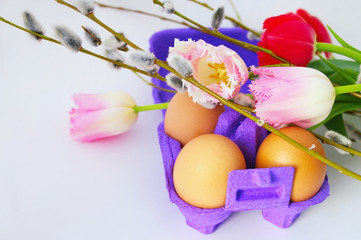 eggs with tulip flowers and willow branches