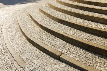 Close up view of old stone granite stairway, curved steps