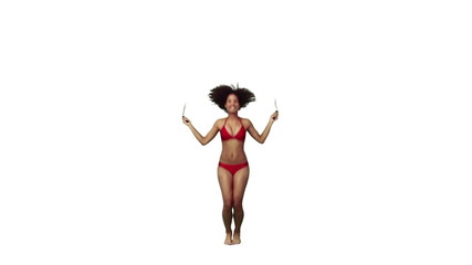A woman in a bikini is using a skipping rope - Powered by Adobe