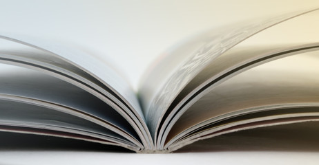 an open book lying on the table