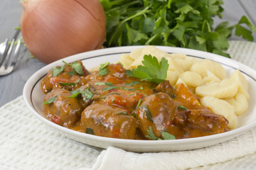 Goulash - Hungarian sausage stew served with homemade nokedli