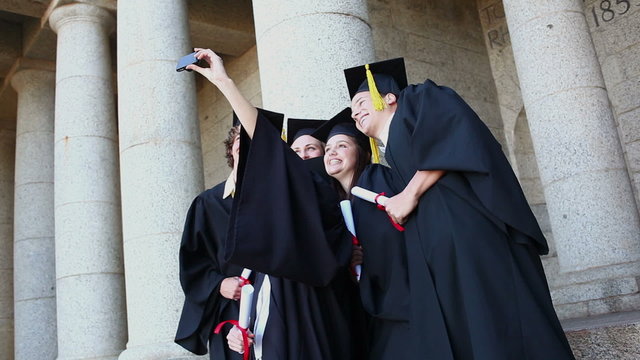 Graduated students taking themselves in picture