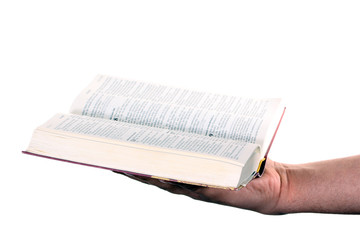 Praying hand hold an open bible