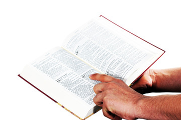 Fototapeta premium Praying hand hold an open bible