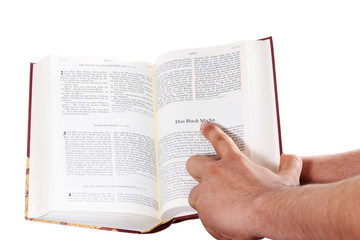 Praying hand hold an open bible