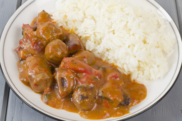 Goulash - Hungarian sausage stew served with white rice