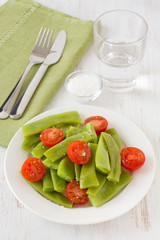 salad green beans and tomato on the plate