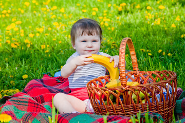 Child having picnic in summer park