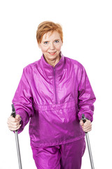 Aktive Frau (64 Jahre) beim Nordic Walking Sport