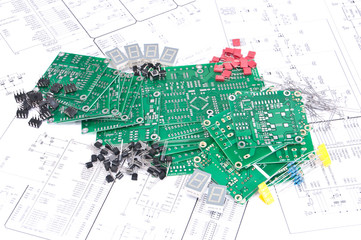 Circuit boards and components with schematics in background