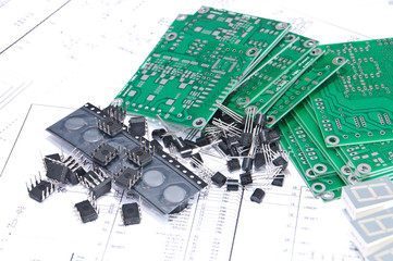 Circuit boards and components with schematics in background