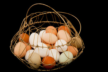 Fototapeta na wymiar Eggs in Metal Wire Basket