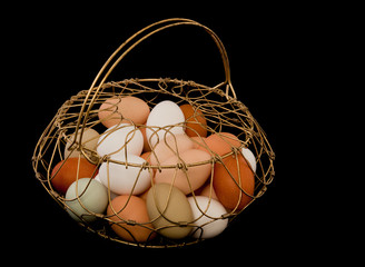 Fototapeta na wymiar Eggs in a Wire Basket