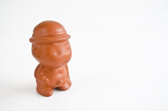 baked clay doll isolate on white background